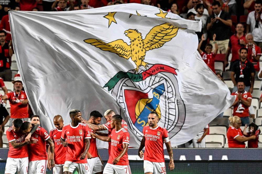 Benfica’s Portuguese forward Goncalo Ramos (centre) celebrates with his teammates after scoring during the Uefa Champions League third qualifying round first leg match between SL Benfica and FC Midtjylland at Luz stadium in Lisbon, August 2, 2022. Uefa today said the semi-automated offside technology (SAOT) will be used in the Champions League this season. — AFP pic 
