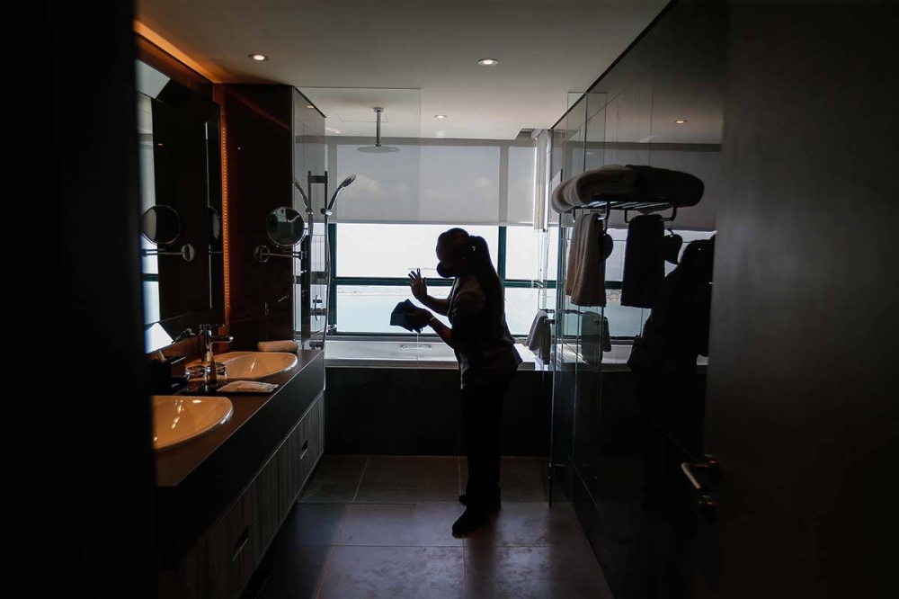 Housekeeping staff tidying up a room at a hotel in Persiaran Gurney March 3, 2022. — Picture by Sayuti Zainudin