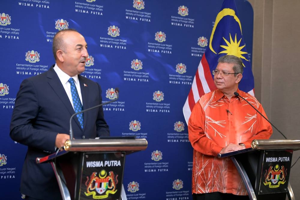 Foreign Minister Datuk Seri Saifuddin Abdullah (right) with Turkey's Minister of Foreign Affairs Mevlut Cavusoglu during a press conference at Parliament, Kuala Lumpur August 4, 2022. — Bernama pic