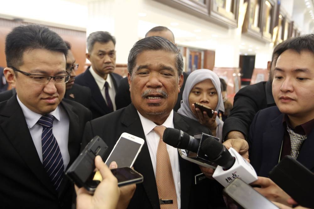 Mohamad Sabu (middle) and Liew Chin Tong (left) want Putrajaya to hold a special Parliament sitting on the Ministry of Defence's procurement of Littoral Combat Ships. — Picture by Yusof Mat Isa