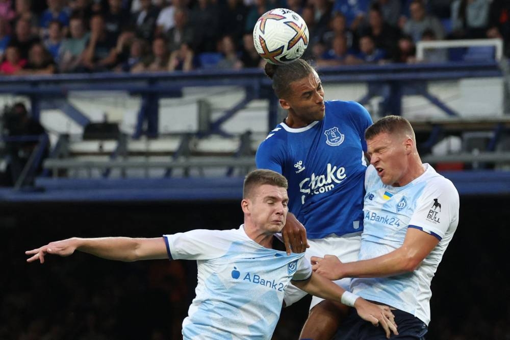 Everton striker Dominic Calvert-Lewin fights for the ball with Dynamo Kiev defenders Anton Bol and Mykyta Burda during a club friendly football match between Everton and Dynamo Kyiv at Goodison Park in Liverpool, July 29, 2022. — AFP pic 