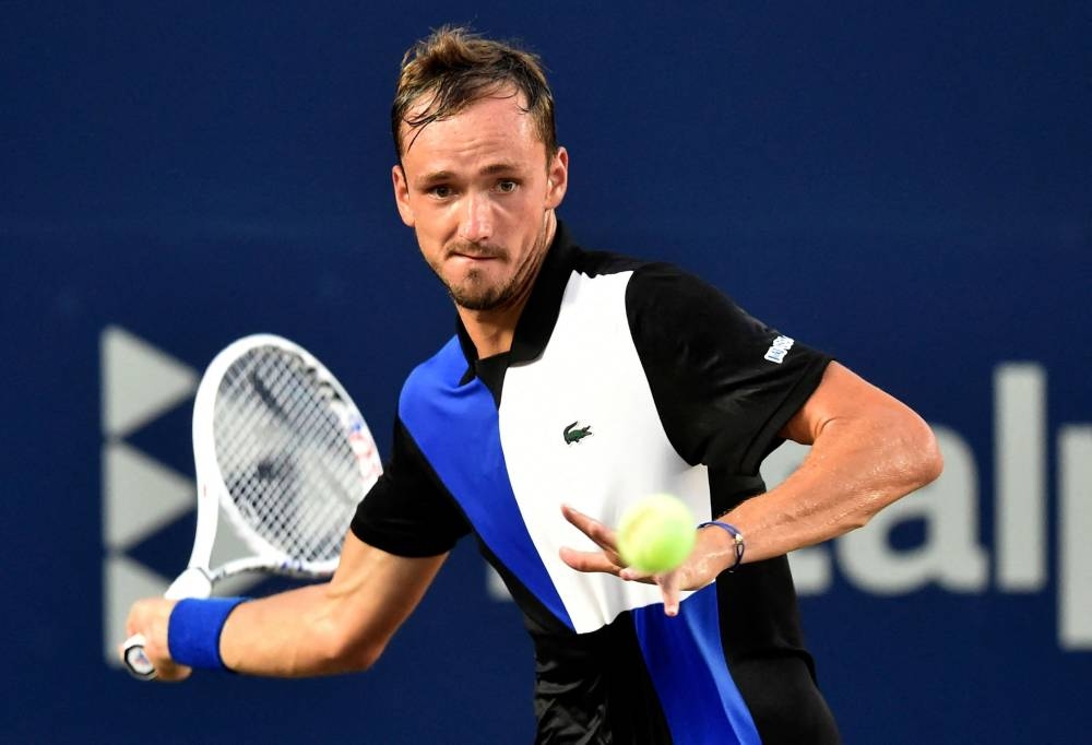 Daniil Medvedev returns the ball to Ricardas Berankis during their Mexico ATP Open 250 men's singles tennis match at the Cabo Sports Complex in Los Cabos August 4, 2022. — AFP pic