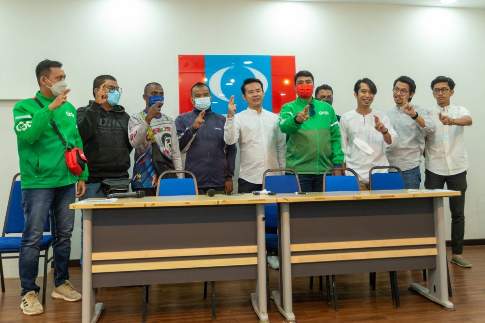 Food delivery riders at a press conference at PKR's headquarters in Petaling Jaya August 5, 2022. — Picture By Devan Manuel