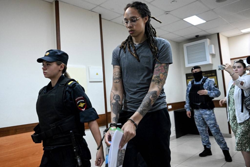 US WNBA basketball player Brittney Griner, who was detained at Moscow's Sheremetyevo airport and later charged with illegal possession of cannabis, leaves the courtroom before the court's final decision in Khimki outside Moscow, on August 4, 2022. — AFP pic