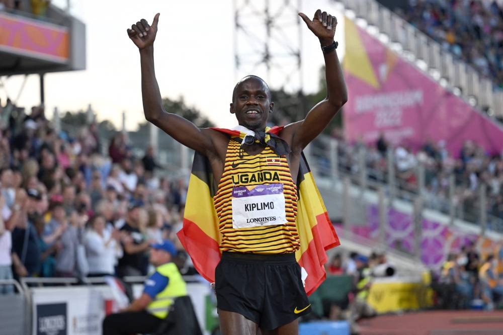 Uganda’s Jacob Kiplimo celebrates winning and taking the gold medal in the men’s 5000m final athletics event at the Alexander Stadium, on day nine of the Commonwealth Games in Birmingham, central England, on August 6, 2022. — AFP pic