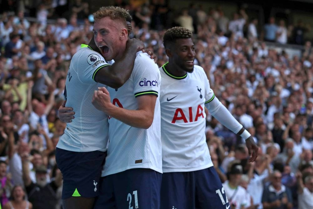 Tottenham Hotspur’s Swedish midfielder Dejan Kulusevski (centre) celebrates with teammates after scoring their fourth goal during the English Premier League football match between Tottenham Hotspur and Southampton at Tottenham Hotspur Stadium in London, on August 6, 2022. — AFP pic