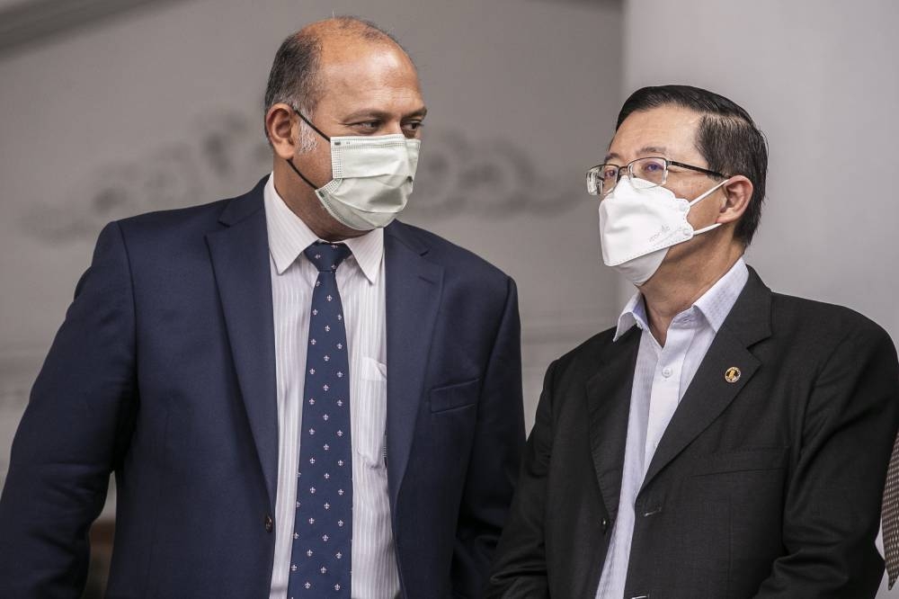 Former Penang chief minister Lim Guan Eng (right) with his lawyer Gobind Singh Deo at the Kuala Lumpur High Court ,August 8, 2022, 2022. — Picture by Hari Anggara