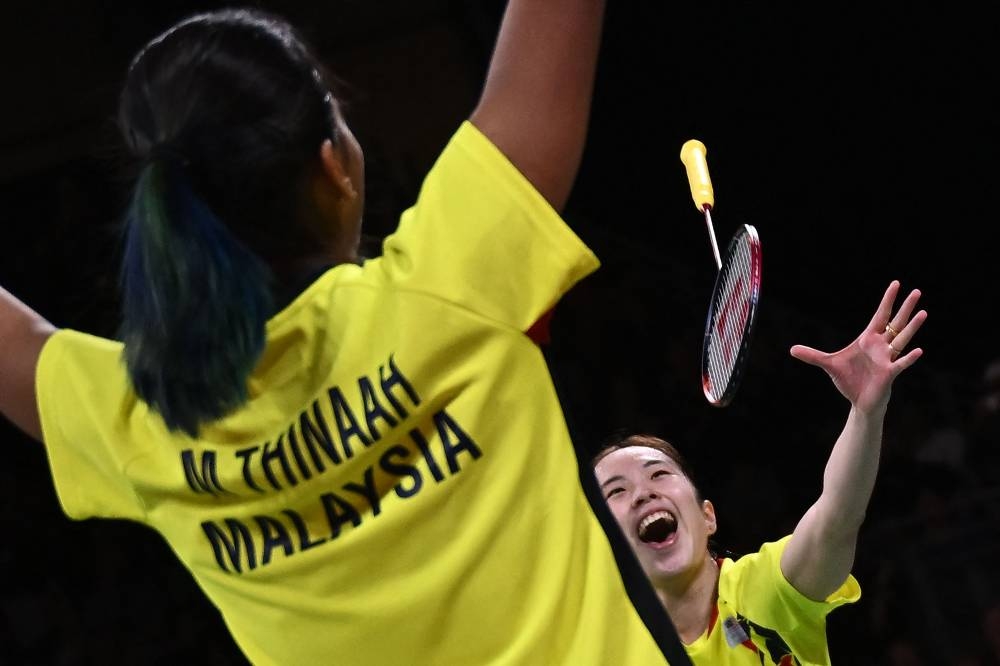 Malaysia’s Pearly Tan and M. Thinaah celebrate winning against England’s Chloe Birch and Lauren Smith in their women’s doubles gold medal badminton match on day eleven of the Commonwealth Games at the NEC arena in Birmingham, central England, August 8, 2022. — AFP pic 