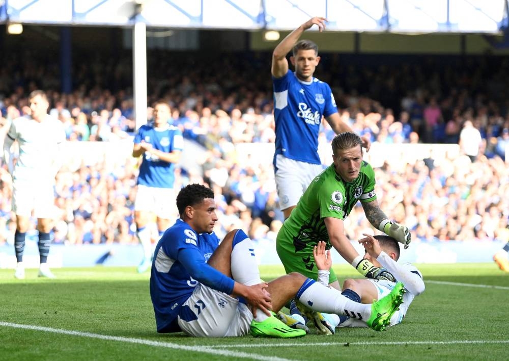 Everton's Ben Godfrey goes down after sustaining an injury against Chelsea at Goodison Park, Liverpool August 6, 2022. — Reuters pic