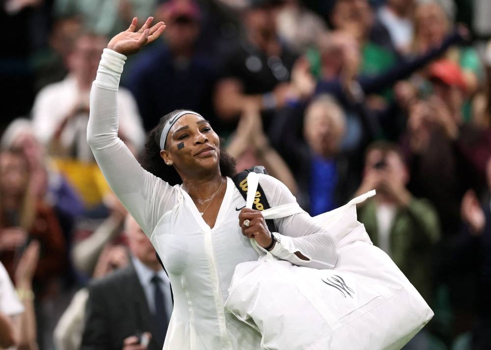 Serena Williams leaves court after losing her first round match against France's Harmony Tan at the All England Lawn Tennis and Croquet Club, London June 28, 2022. — Reuters pic 