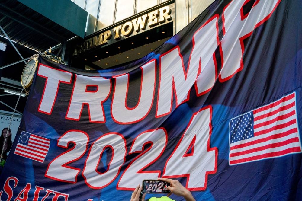 Trump supporters rally outside of Trump Tower after the former US President Donald Trump said that FBI agents raided his Mar-a-Lago Palm Beach home, in New York City August 9, 2022. — Reuters pic
