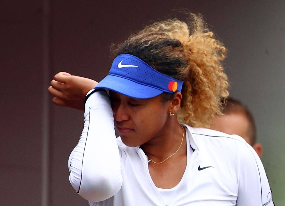 Naomi Osaka of Japan wipes a tear after she retired early from her match against Kaia Kanepi during the National Bank Open at the Sobeys Stadium in Toronto August 9, 2022. — Reuters pic