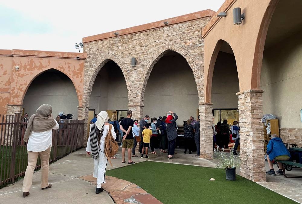 Participants in an interfaith memorial ceremony enter the New Mexico Islamic Center mosque to commemorate four murdered Muslim men, hours after police said they had arrested a prime suspect in the killings, in Albuquerque, New Mexico, US August 9, 2022. ― Reuters pic