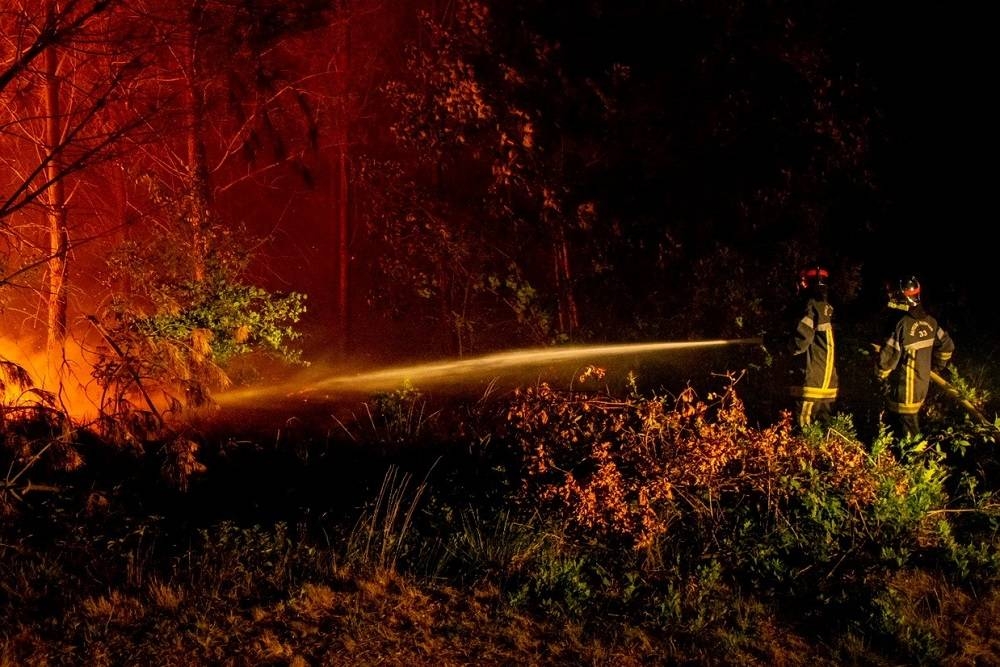 Firefighters work following a fire that broke out near Landiras, as wildfires continue to spread in the Gironde region of southwestern France, in this handout picture taken July 16, 2022 and obtained from the fire brigade of the Gironde region (SDIS 33) on July 17, 2022. ― SDIS 33/Handout via Reuters