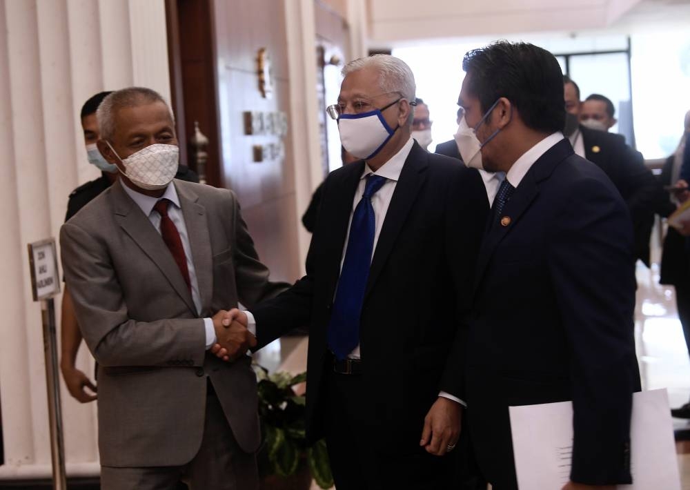 Prime Minister and Bera Member of Parliament Datuk Seri Ismail Sabri Yaakob (centre) at the Parliament Building August 9, 2022. Ismail Sabri said the Cabinet also urged the Malaysian Anti-Corruption Commission (MACC) to hasten investigations into the issue and should strong evidence surface, the AG must prosecute those responsible. — Bernama pic 