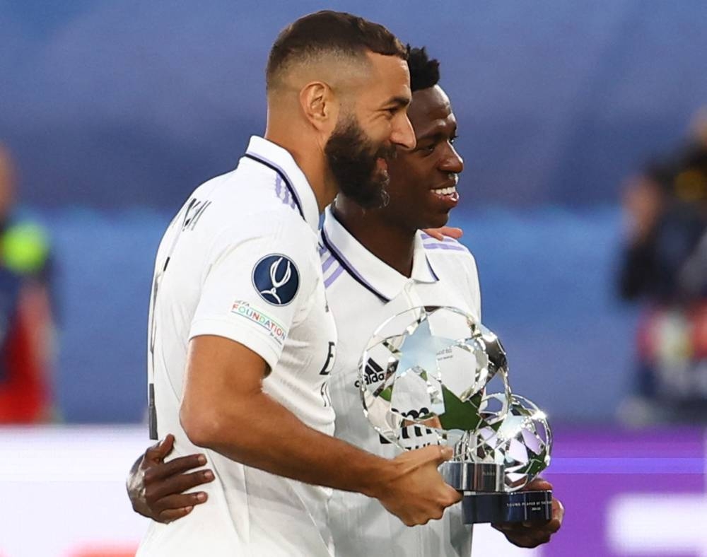 Real Madrid’s Karim Benzema and Vinicius Junior with the Champions League player of the year and young player of the year trophies before the match against Eintracht Frankfurt at the Helsinki Olympic Stadium, Helsinki, Finland, August 10, 2022. — Reuters pic 