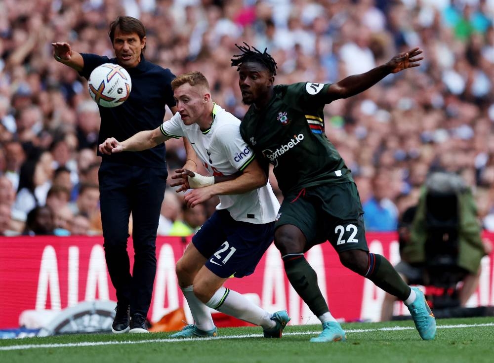 Tottenham Hotspur’s Dejan Kulusevski in action with Southampton’s Mohammed Salisu as Tottenham Hotspur manager Antonio Conte looks on, Tottenham Hotspur Stadium, London, August 6, 2022. — Action Images via Reuters pic 