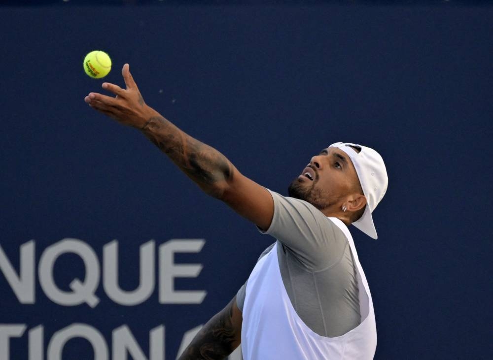 Nick Kyrgios serves against Alex De Minaur in third round play at the National Bank Open at IGA Stadium, Montreal August 11, 2022. — Reuters pic