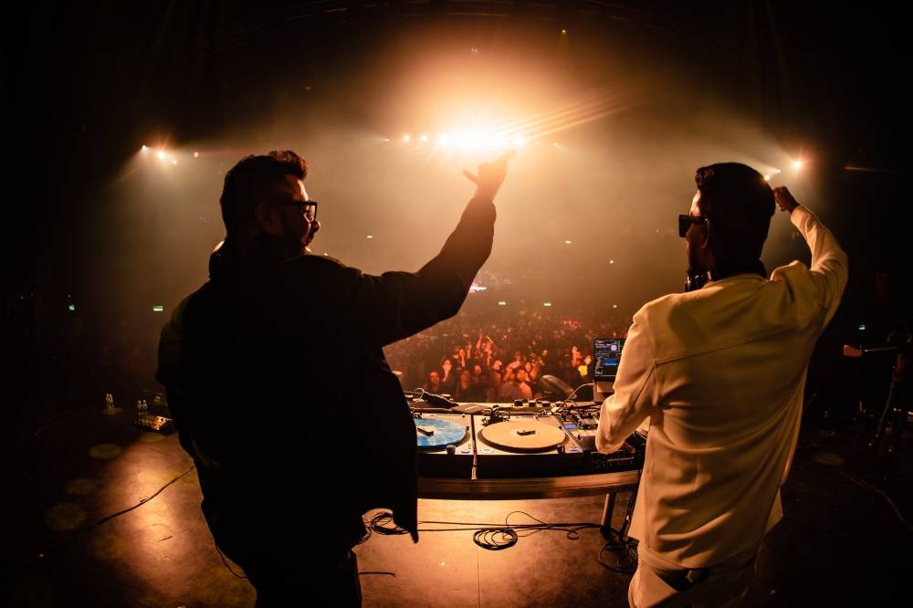 Malaysian homegrown boys: DJ Jay (left) and DJ Nexto (right) hyping up the concert with crowd's favourite 90s Tamil songs. — Pic by Barathan Amuthan.