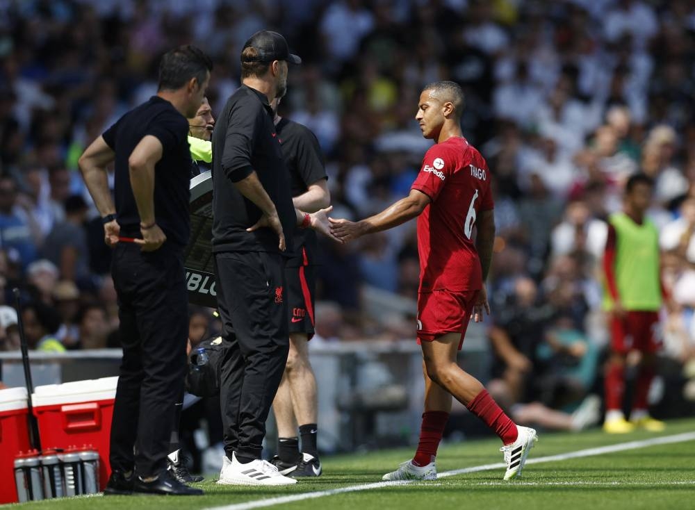 Liverpool’s Thiago Alcantara touches hands with manager Jurgen Klopp as he is substituted off after sustaining an injury during the match against Fulham at Craven Cottage in London, August 6, 2022. — Action Images pic via Reuters