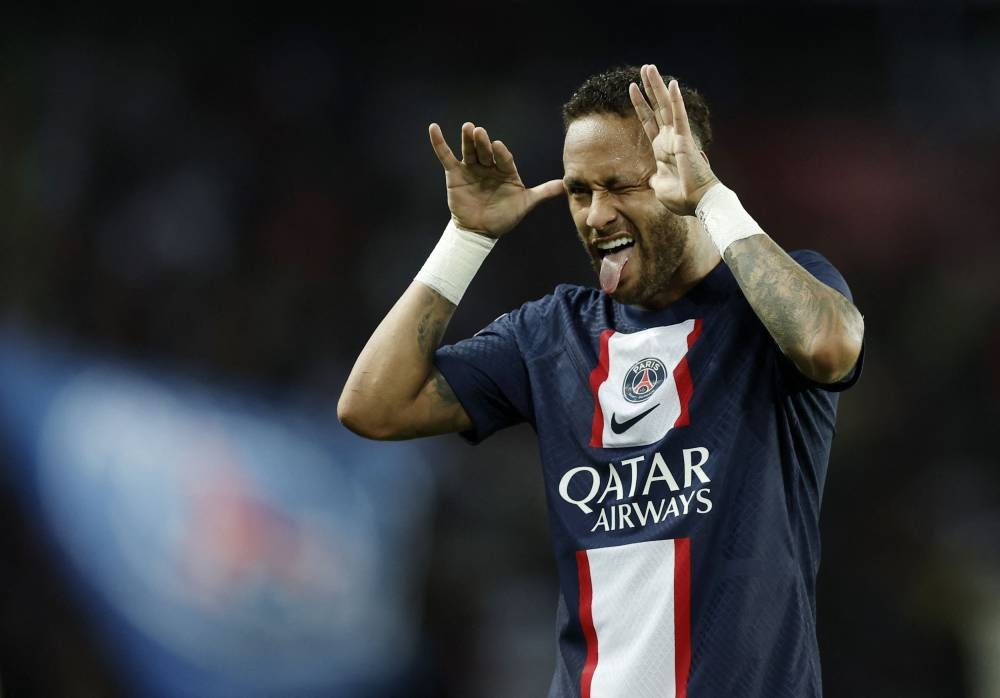 Paris St Germain's Neymar celebrates scoring their third goal against Montpellier at Parc des Princes, Paris August 13, 2022. — Reuters pic 
