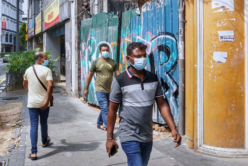 Foreign workers are seen wearing protective masks in public in Kuala Lumpur November 28, 2021. — Picture by Ahmad Zamzahuri