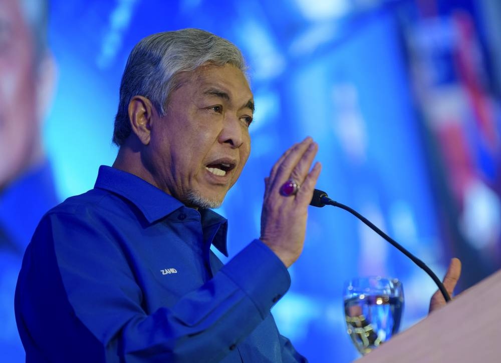 Barisan Nasional chairman Datuk Seri Ahmad Zahid Hamidi delivers a speech at the Wanita BN Convention, World Trade Centre, August 14, 2022. — Bernama pic    