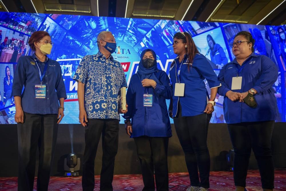 Prime Minister Datuk Seri Ismail Sabri Yaakob with Wanita BN chairman Datuk Seri Noraini Ahmad (3rd right) at the Wanita BN convention in Kuala Lumpur, August 14, 2022. — Bernama pic 
