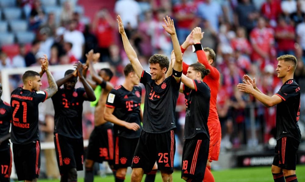  Bayern Munich's Thomas Muller with teammates celebrate after the match against VfL Wolfsburg at the Allianz Arena, Munich August 14, 2022. — Reuters pic 