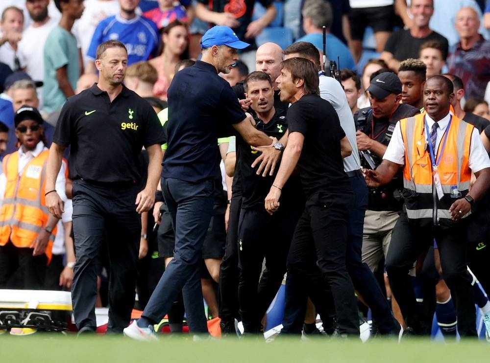 Chelsea manager Thomas Tuchel clashes with Tottenham Hotspur manager Antonio Conte after the match at Stamford Bridge, London August 14, 2022. — Reuters pic