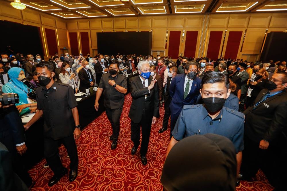 Prime Minister Datuk Seri Ismail Sabri Yaakob greets delegates after officiating the 2022 Health Policy Summit at the Kuala Lumpur World Trade Centre August 15, 2022. — Picture by Sayuti Zainudin