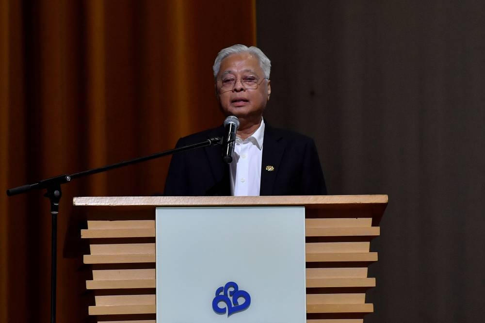 Prime Minister Datuk Seri Ismail Sabri Yaakob delivers a speech at a high-tea event with Malaysian women media practitioners organised by the Malaysian Women Journalists Association in Kuala Lumpur, August 15, 2022. — Bernama pic   