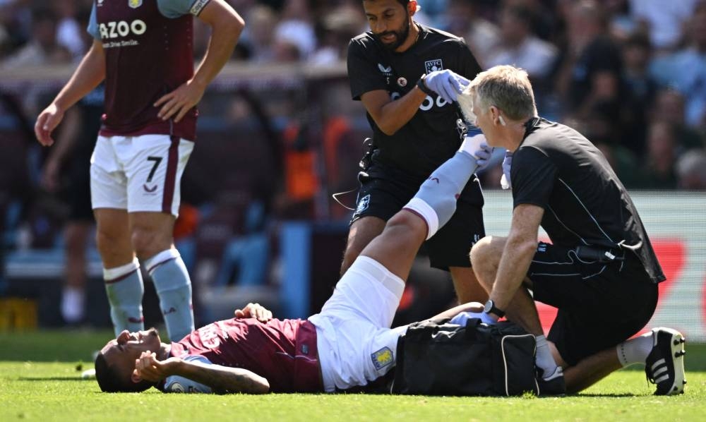 Aston Villa’s Diego Carlos receives medical attention after sustaining an injury during a match against Everton at Villa Park, Birmingham, Britain, August 13, 2022. — Reuters pic 