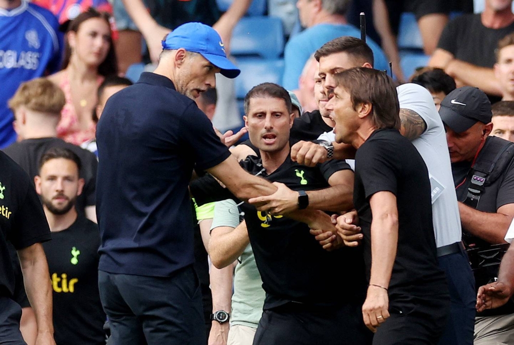 Chelsea manager Thomas Tuchel clashes with Tottenham Hotspur manager Antonio Conte after the match at Stamford Bridge, London August 14, 2022. — Reuters pic