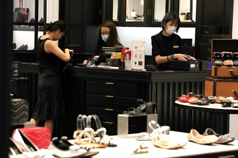 In all, some 46,000 full-time and part-time resident workers would benefit from pay rises of 18 per cent spread over three years starting September 1 this year for jobs in the lower rungs of the retail sector. — TODAY pic