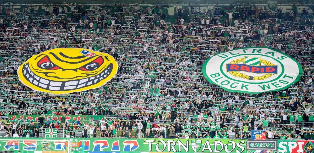 Rapid Wien supporters cheer during the Europa Conference League qualification, third round second leg match between SK Rapid Wien and Neftchi (Baku), at the Allianz-Stadion stadium in Vienna, August 11, 2022. Two African players from Viborg FF will not be able to travel for their playoff against West Ham United due to English entry rules for non-EU citizens after Brexit. — APA pic via AFP  