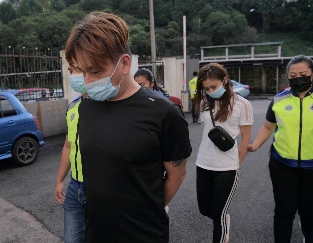 Loh Kok Kiong, 49, and Soh Yong Xin, 32, were jointly charged with the offence at a house at Jalan Forest City 15, Forest City in Gelang Patah at 11.15am on August 9. — Bernama pic 