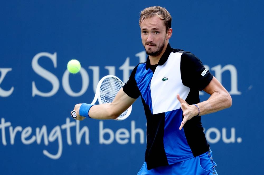 Daniil Medvedev returns a shot to Denis Shapovalov during the Western & Southern Open at Lindner Family Tennis Centre in Cincinnati August 18, 2022. — AFP pic