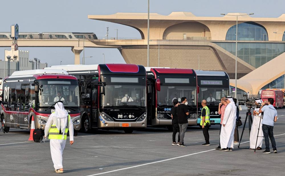 This picture taken no August 18, 2022 shows a view of some of the 1300 buses operated by Mowasalat Qatar -- the official land transport provider in the gulf emirate -- during a test run in Doha amidst preparations ahead of the Qatar 2022 Fifa World Cup.  — AFP pic