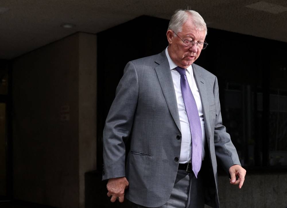 Former Manchester United manager Alex Ferguson leaves Manchester Crown Court in Manchester as Former Manchester United footballer Ryan Giggs appears in court, Britain, August 19, 2022. — Reuters pic