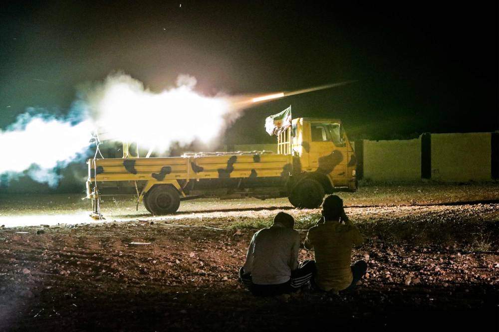 A long-range grad rocket is launched by Turkish-backed Syrian fighters, reportedly targeting Kuweires military airfield and other points along the frontlines with areas held the Syrian Democratic Forces, in the district of al-Azraq in the rebel-held part in the north of Syria's Aleppo province early August 20, 2022. — AFP pic