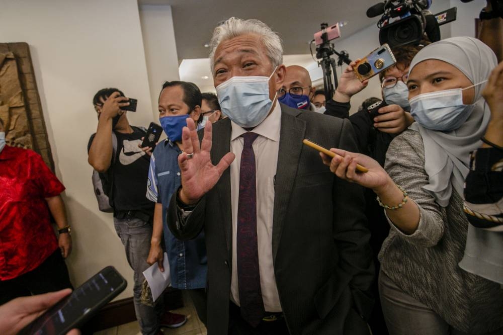 Sabah BN chairman and Umno chief Datuk Seri Bung Moktar Radin leaving after attending a Gabungan Rakyat Sabah (GRS) meeting at the Hotel Magellan in Kota Kinabalu September 27, 2020. — Picture by Firdaus Latif.