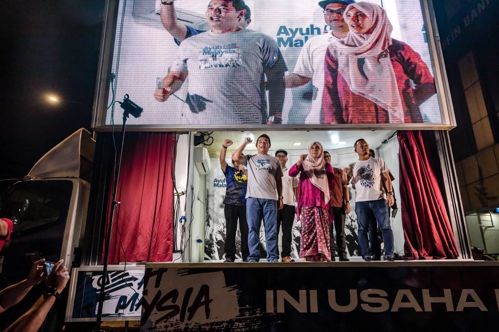 PKR deputy president, Rafizi Ramli with other PKR leaders during the AyuhMalaysia truck campaign in Wangsa Maju, Kuala Lumpur on August 20, 2022. — Picture by Firdaus Latif