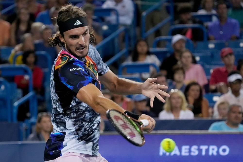 Stefanos Tsitsipas of Greece plays a forehand during his match against Daniil Medvedev of Russia during the Western & Southern Open at the Lindner Family Tennis Center on August 20, 2022 in Mason, Ohio. —  Dylan Buell/Getty Images/AFP pic