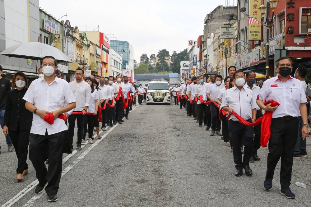 DAP leaders and family follow the cortege ahead of the funeral service of the DAP founding chairman Dr Chen Man Hin during the funeral ceremony in Seremban August 21, 2022. — Picture by Yusof Mat Isa