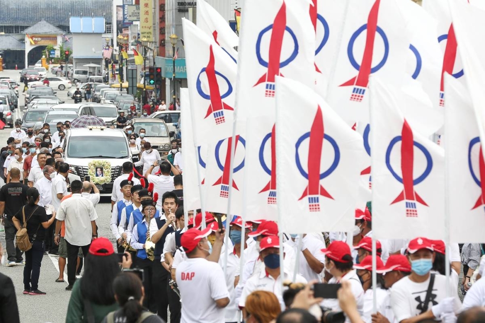 DAP leaders and family follow the cortege ahead of the funeral service of the DAP founding chairman Dr Chen Man Hin during the funeral ceremony in Seremban August 21, 2022. — Picture by Yusof Mat Isa