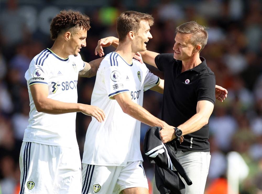 Leeds United's Diego Llorente and manager Jesse Marsch celebrate after the Leeds United v Chelsea matach at Elland Road, Leeds, August 21, 2022  — Reuters pic