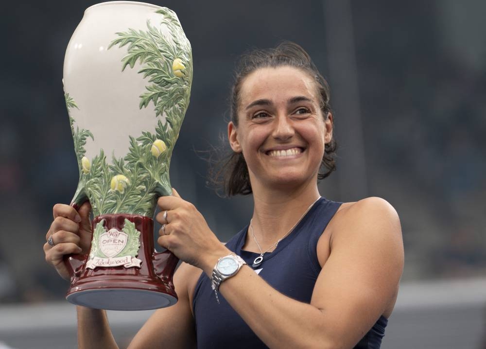 Caroline Garcia poses with the trophy after winning the womenﾕs final match against Petra Kvitova at the Western & Southern Open at the Lindner Family Tennis Centre in Cincinnati August 21, 2022. — Reuters pic