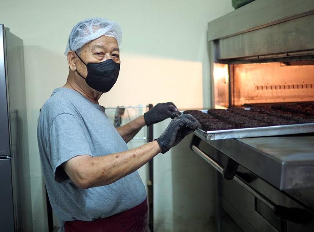 Goh bakes the mooncakes in small batches based on pre-orders from their customers.