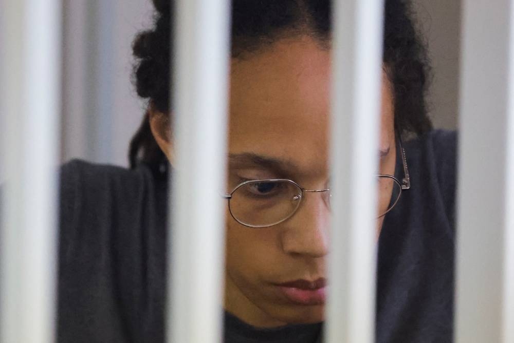 US basketball player Brittney Griner, who was detained at Moscow's Sheremetyevo airport and later charged with illegal possession of cannabis, sits inside a defendants' cage after the court's verdict in Khimki August 4, 2022. — Reuters pic